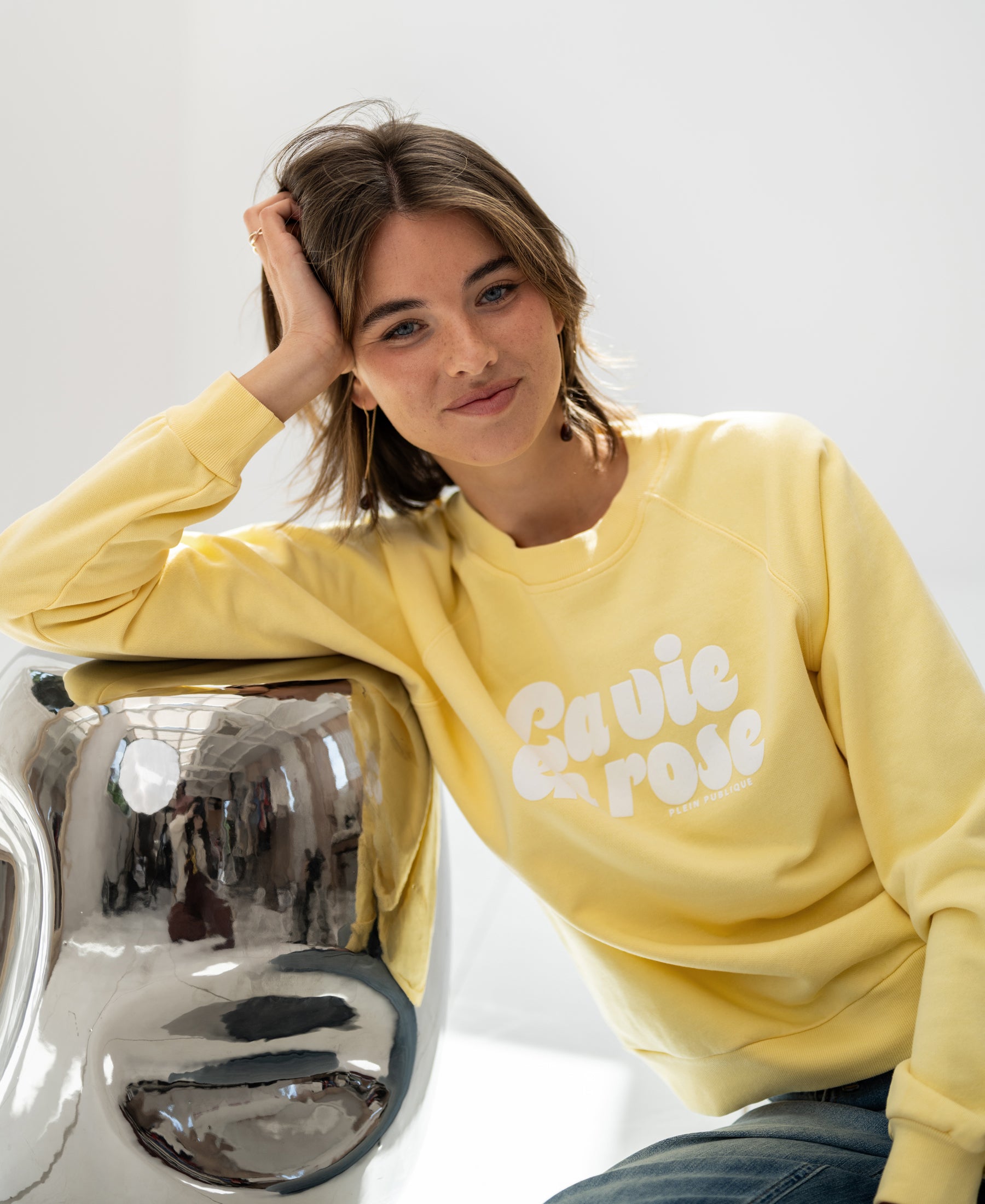 Yellow LA HARPER sweater by PLEIN PUBLIQUE displayed against a white background.