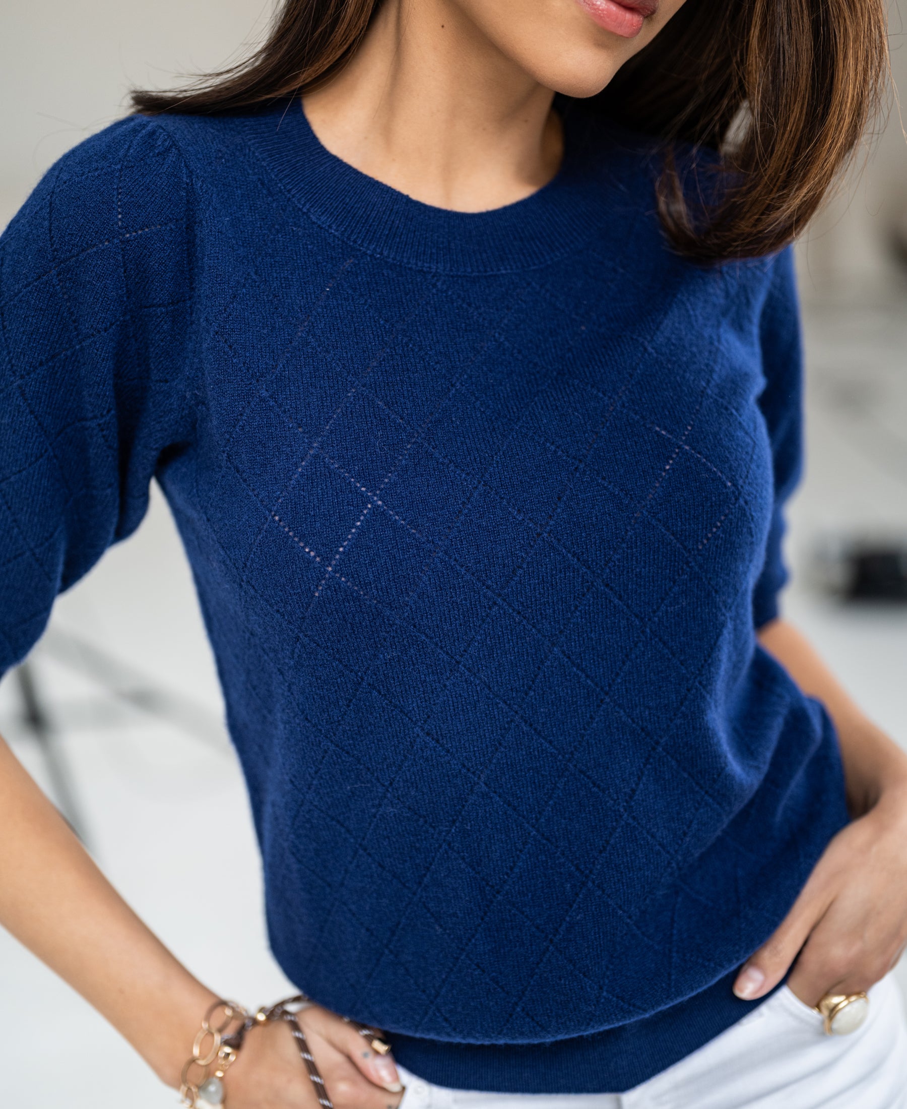 Navy argyle merino wool sweater shown from the front.