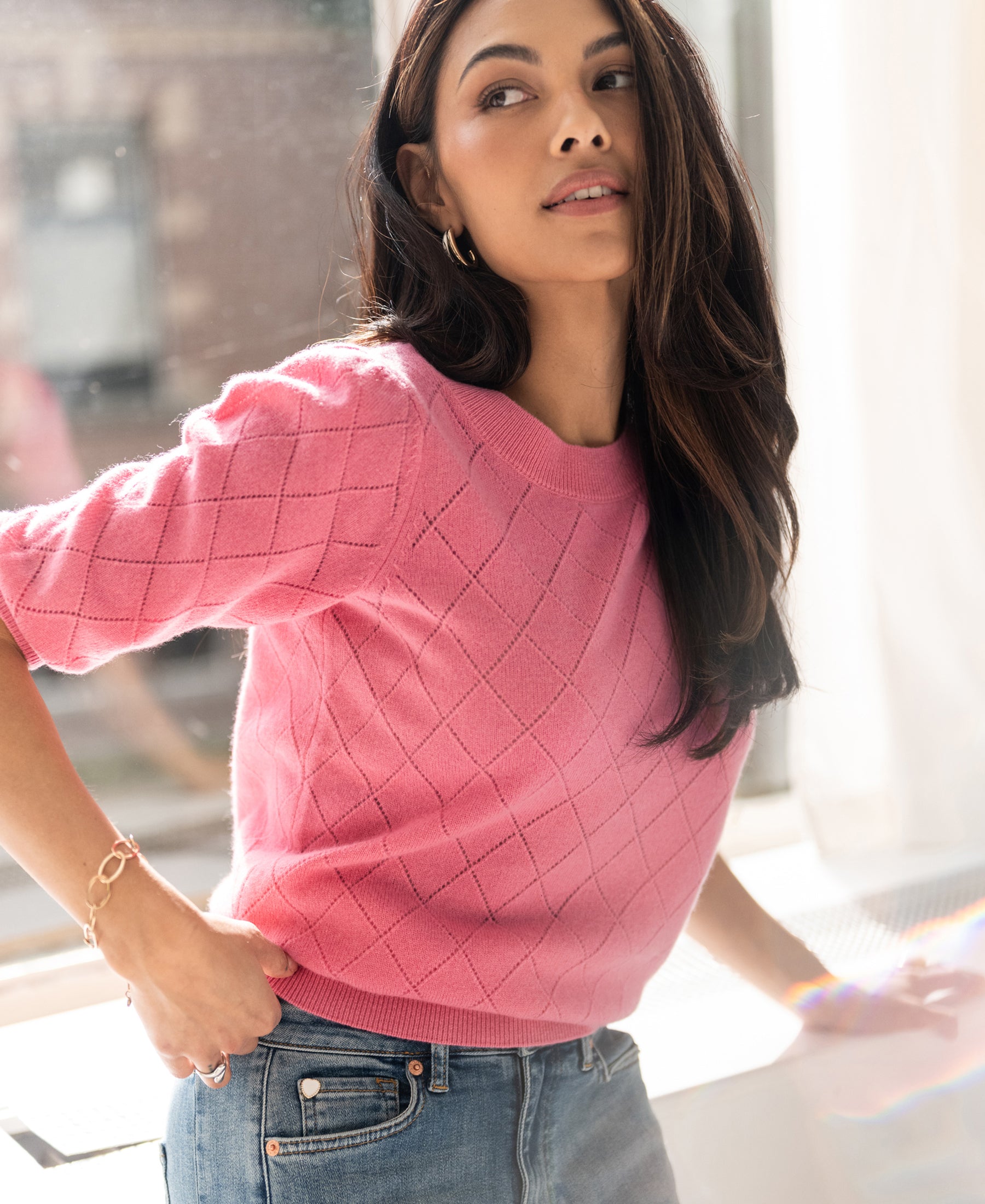 Pink argyle merino wool sweater LE HARVARD by PLEIN PUBLIQUE shown in side view.