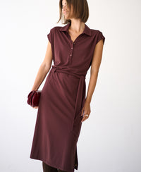 Brown Travel polo dress by PLEIN PUBLIQUE shown on a woman against a plain white background.