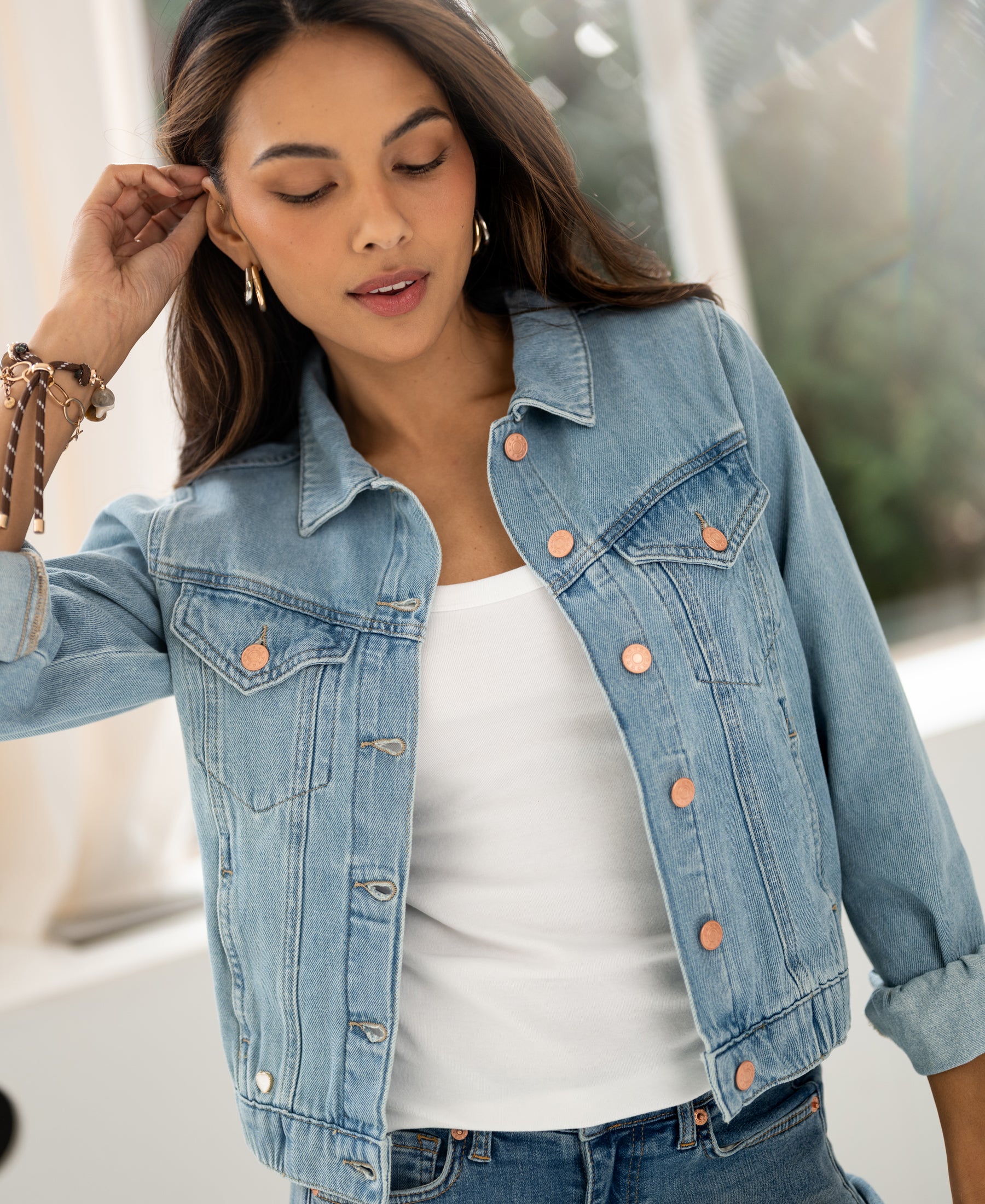 Bleached denim jacket in a relaxed fit, shown indoors.