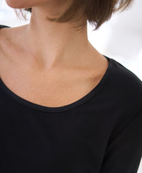 Lyocell long sleeve T-shirt in black, featuring neckline, collarbone, and jawline.