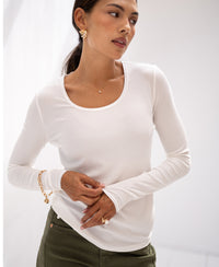 Woman wearing ivory long sleeve lyocell T-shirt.