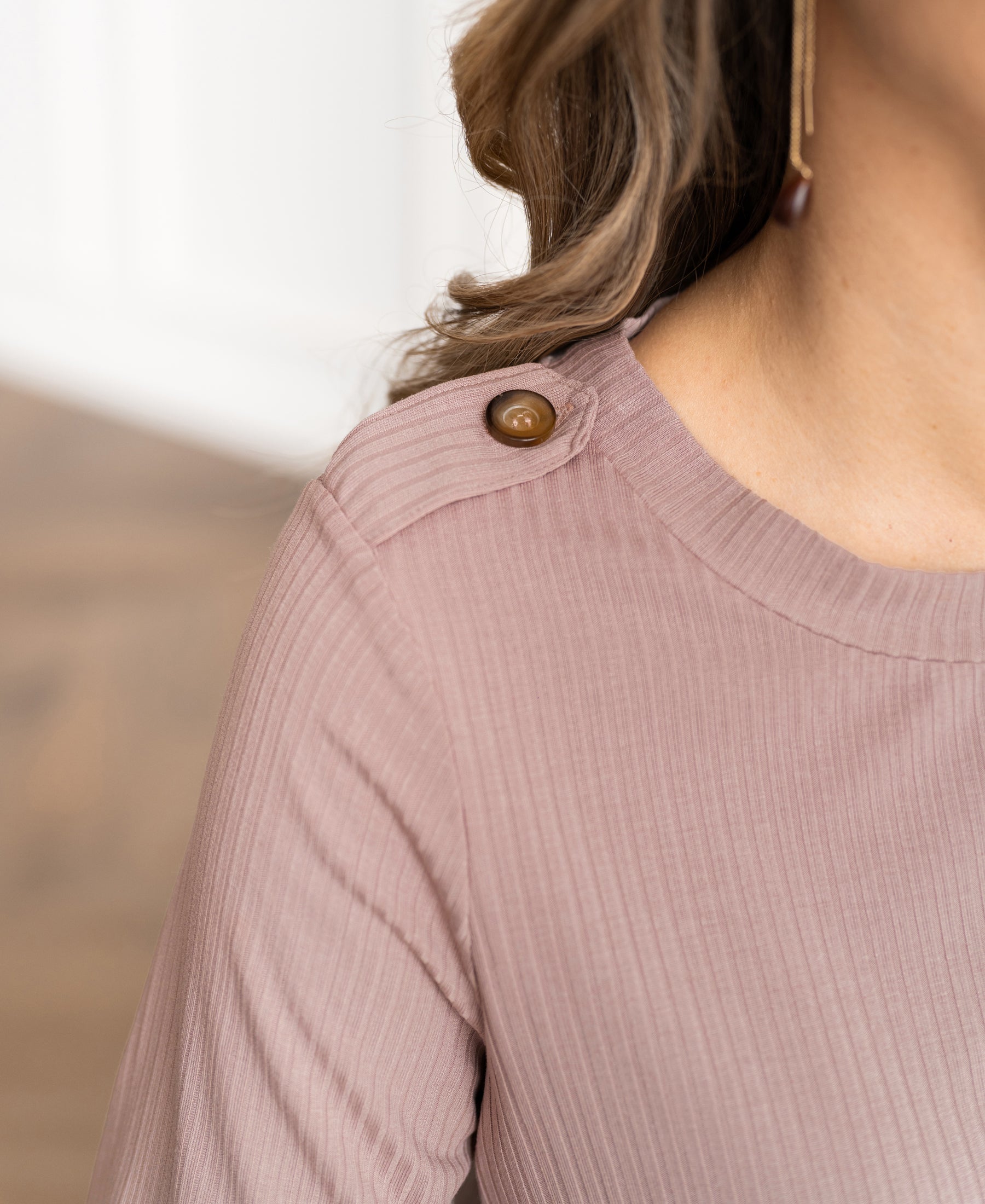 Close-up of dusty pink bamboo T-shirt with brown buttons from PLEIN PUBLIQUE, product name The Garden.