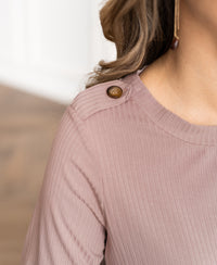 Close-up of dusty pink bamboo T-shirt with brown buttons from PLEIN PUBLIQUE, product name The Garden.