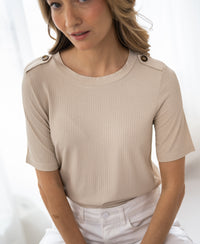 Light sand bamboo T-shirt in LE JARDIN style, shown worn by a woman indoors near a window.