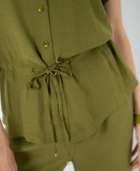 Close-up of an olive green PLEIN PUBLIQUE LA JODY blouse with drawstring waist and matching buttons.