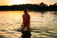 LA JODY Terra blouse by PLEIN PUBLIQUE shown in golden sunset light.