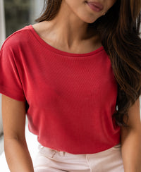 Red two-way T-shirt shown from shoulders to waist.