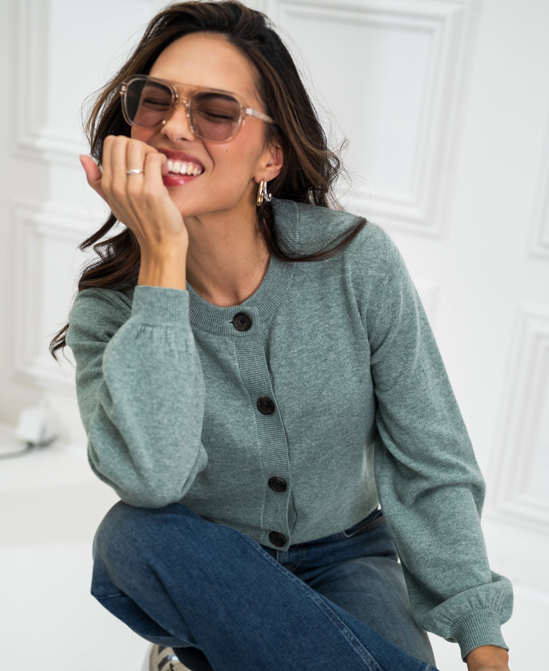 Mist green PLEIN PUBLIQUE round neck cardigan LA LEA shown indoors.