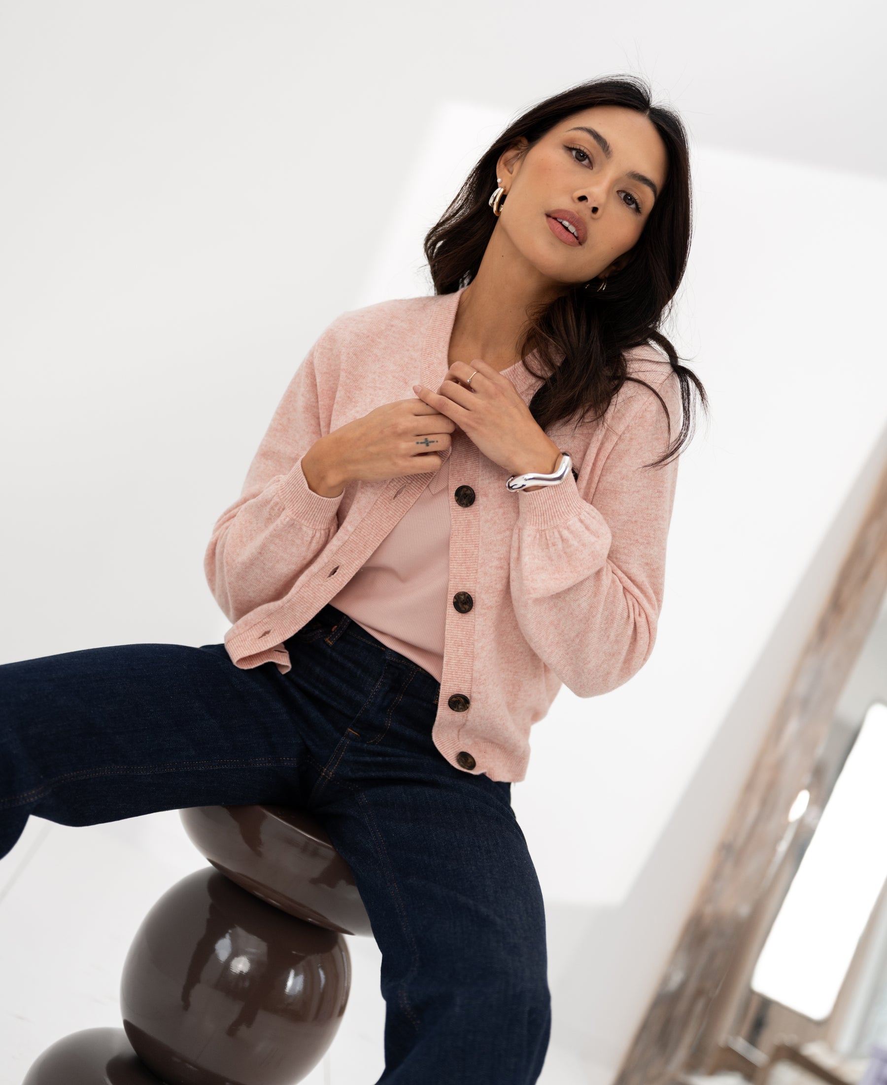 Pink round neck vest by Plein Publique displayed in a bright room.