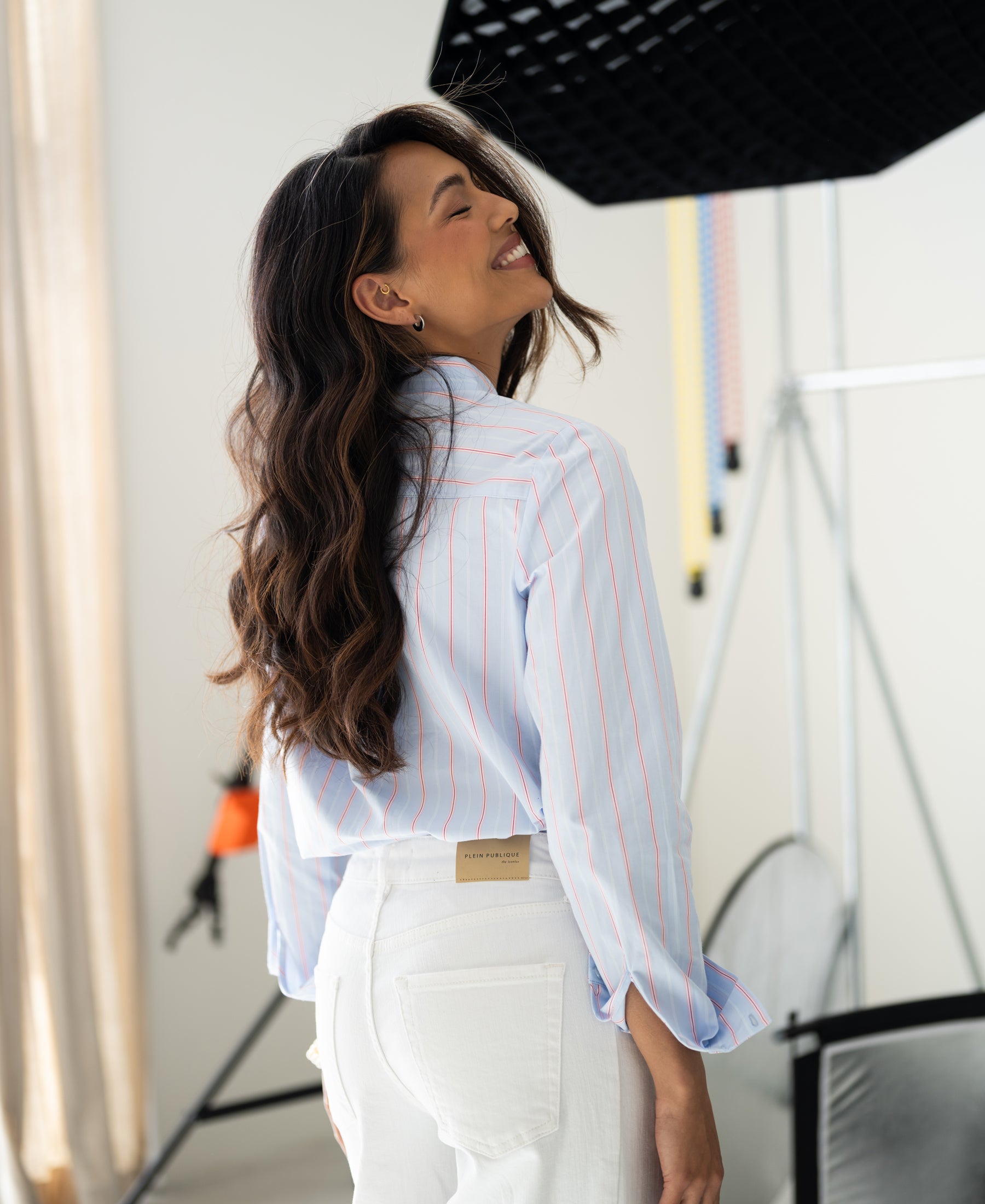 Striped blouse in light blue and coral.