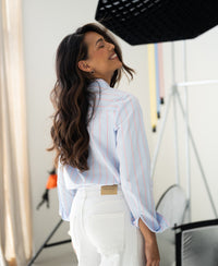 Striped blouse in light blue and coral.