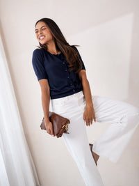 Navy blue merino wool and silk cardigan LA LORAINE by PLEIN PUBLIQUE, shown on a woman with eyes closed.
