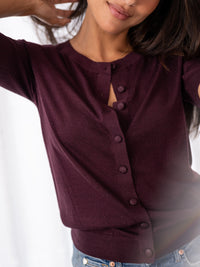 Purple merino wool and silk cardigan by PLEIN PUBLIQUE, style LA LORAINE, shown against a white background.