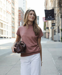 Dusty pink Merino wool top by Plein Publique shown on model.