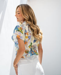 Light blue floral print blouse top LA LUNETTE shown in bright natural light.