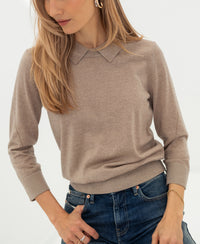 Merino wool polo sweater LA MARCEAU by PLEIN PUBLIQUE shown worn, model looks downward.