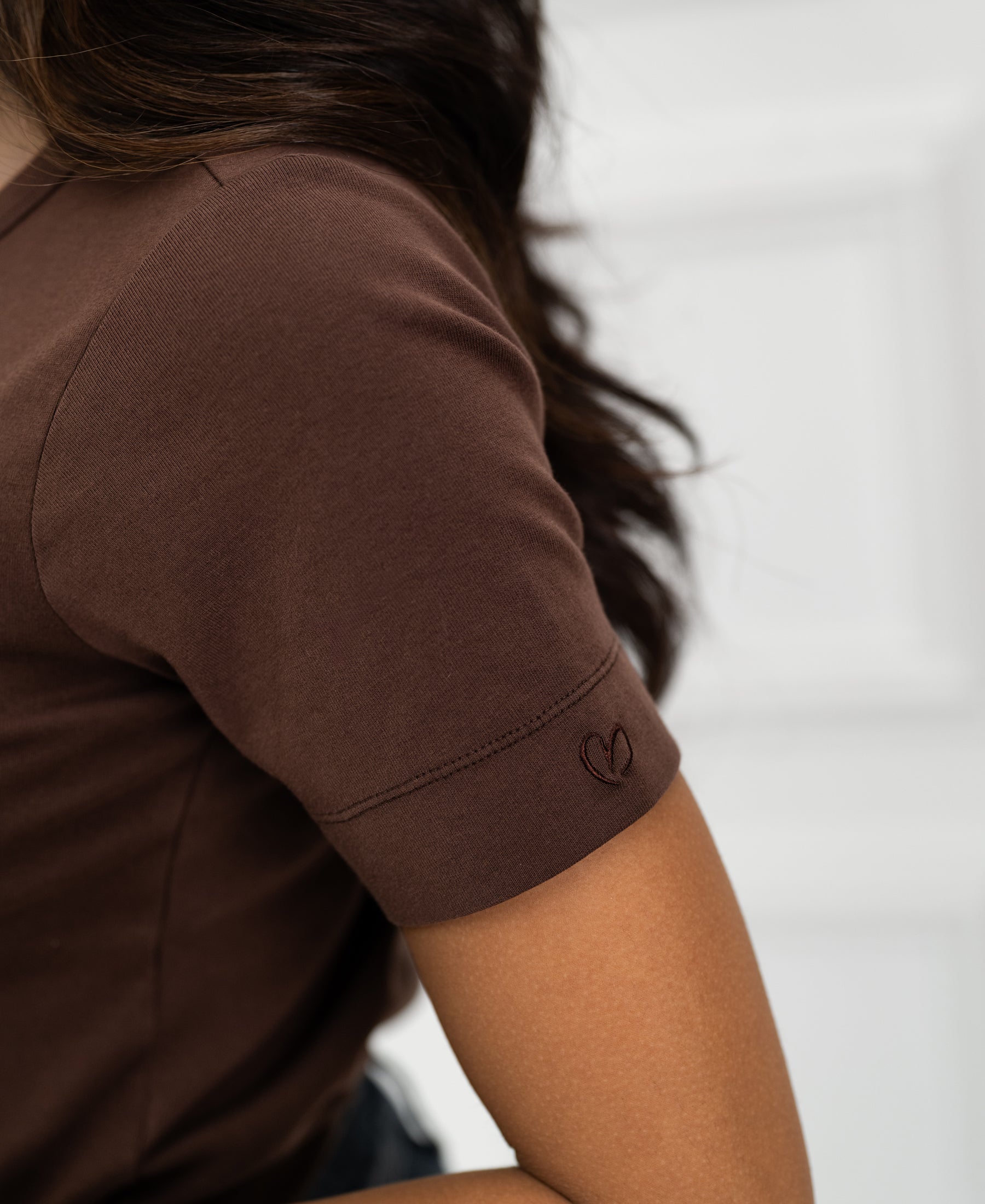 Luxe & Soft T-shirt in brown by PLEIN PUBLIQUE, features a small heart on the sleeve.