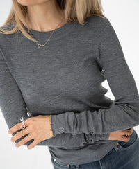 Woman wearing a PLEIN PUBLIQUE Merino wool shirt in grey.