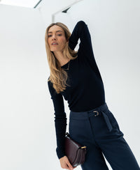 Luxe merino wool shirt in dark blue by PLEIN PUBLIQUE, shown indoors.