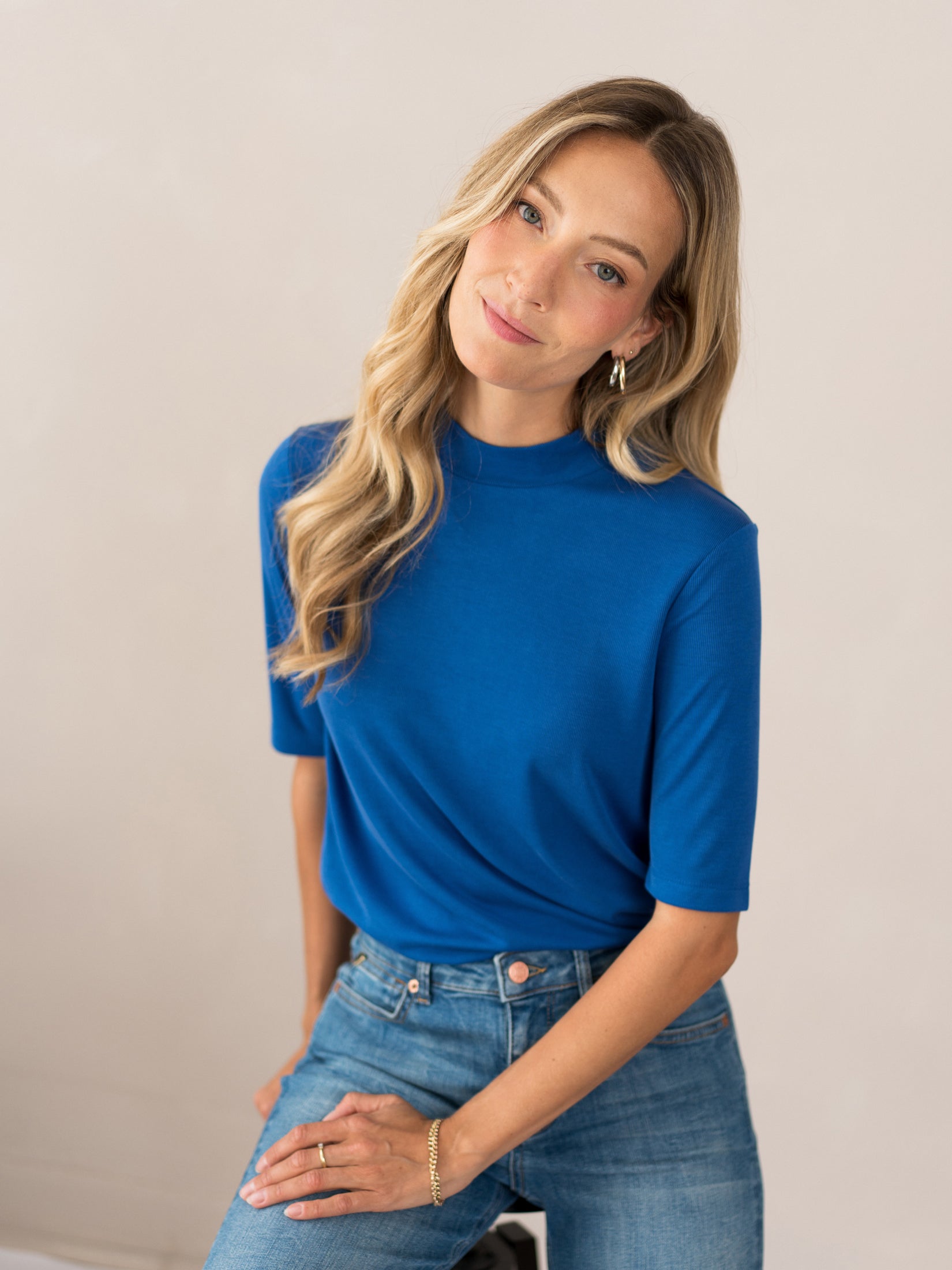 Cobalt blue ribbed cotton top with collar, shown against a light background.