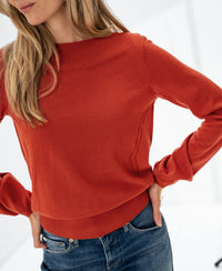 PLEIN PUBLIQUE LA MUSE boat neck sweater in Cayenne, shown against a bright background.