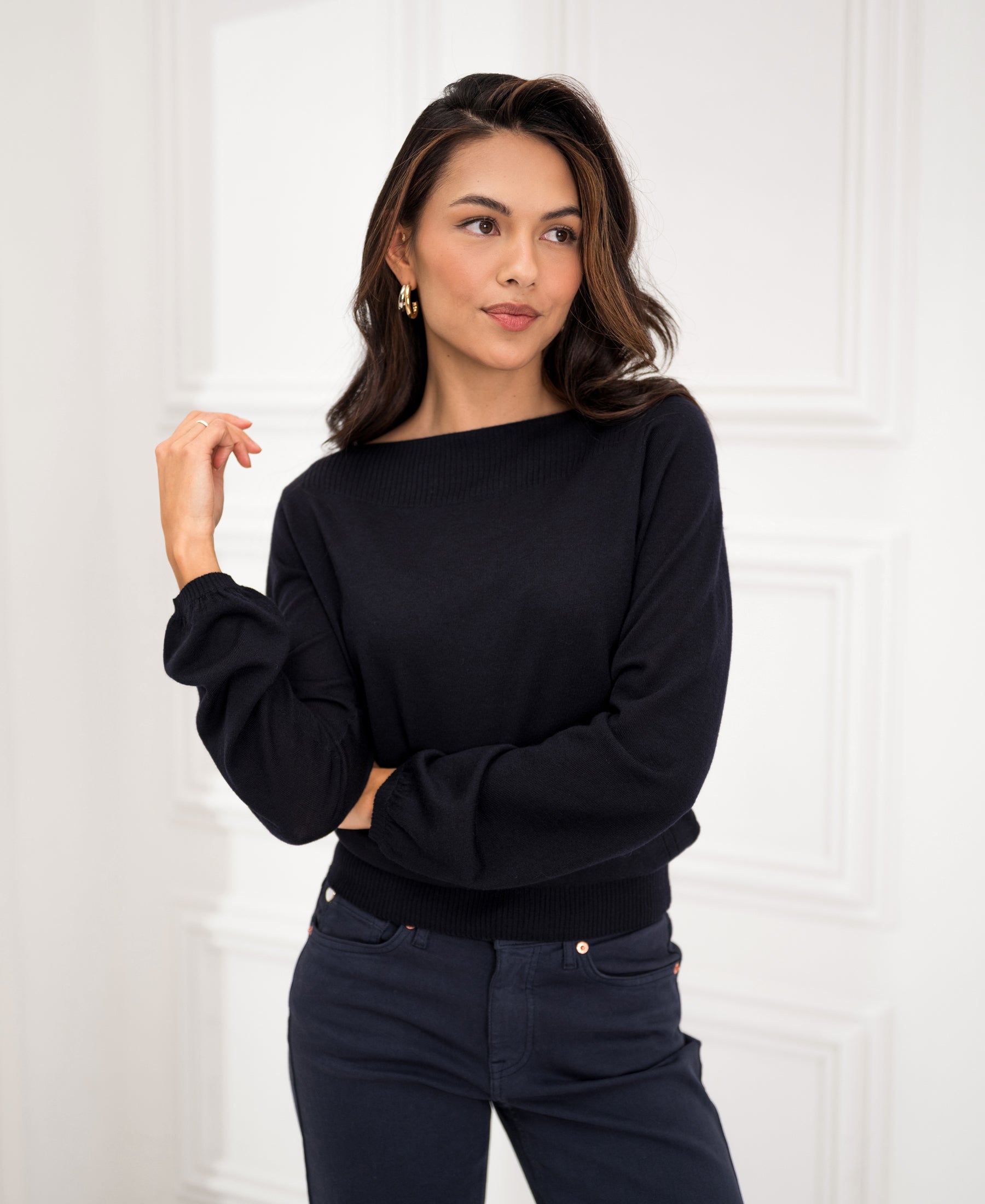Navy blue LA MUSE boatneck sweater from PLEIN PUBLIQUE shown against a white wall.