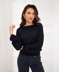 Navy blue LA MUSE boatneck sweater from PLEIN PUBLIQUE shown against a white wall.