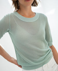 Mist green mesh sweater with short sleeves.