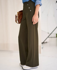 Side view of dark olive green travel pants by PLEIN PUBLIQUE.