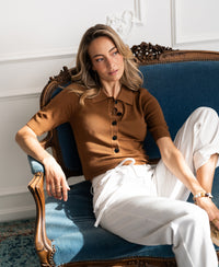 Camel merino wool polo shirt by PLEIN PUBLIQUE, LA PANTIN style, shown worn by a woman.