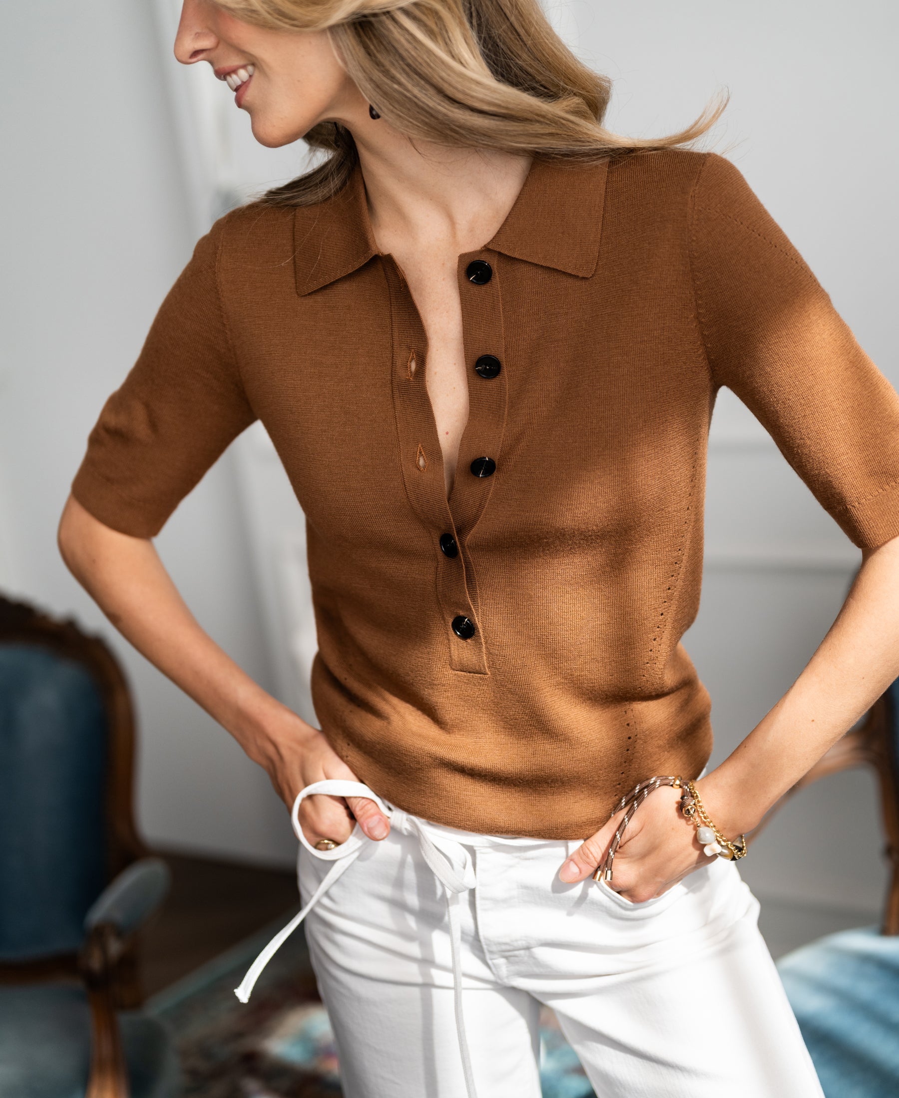 Camel merino wool polo shirt from PLEIN PUBLIQUE, shown on model from side view.