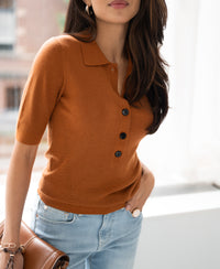 Woman wearing the Terra merino wool polo shirt by PLEIN PUBLIQUE indoors.