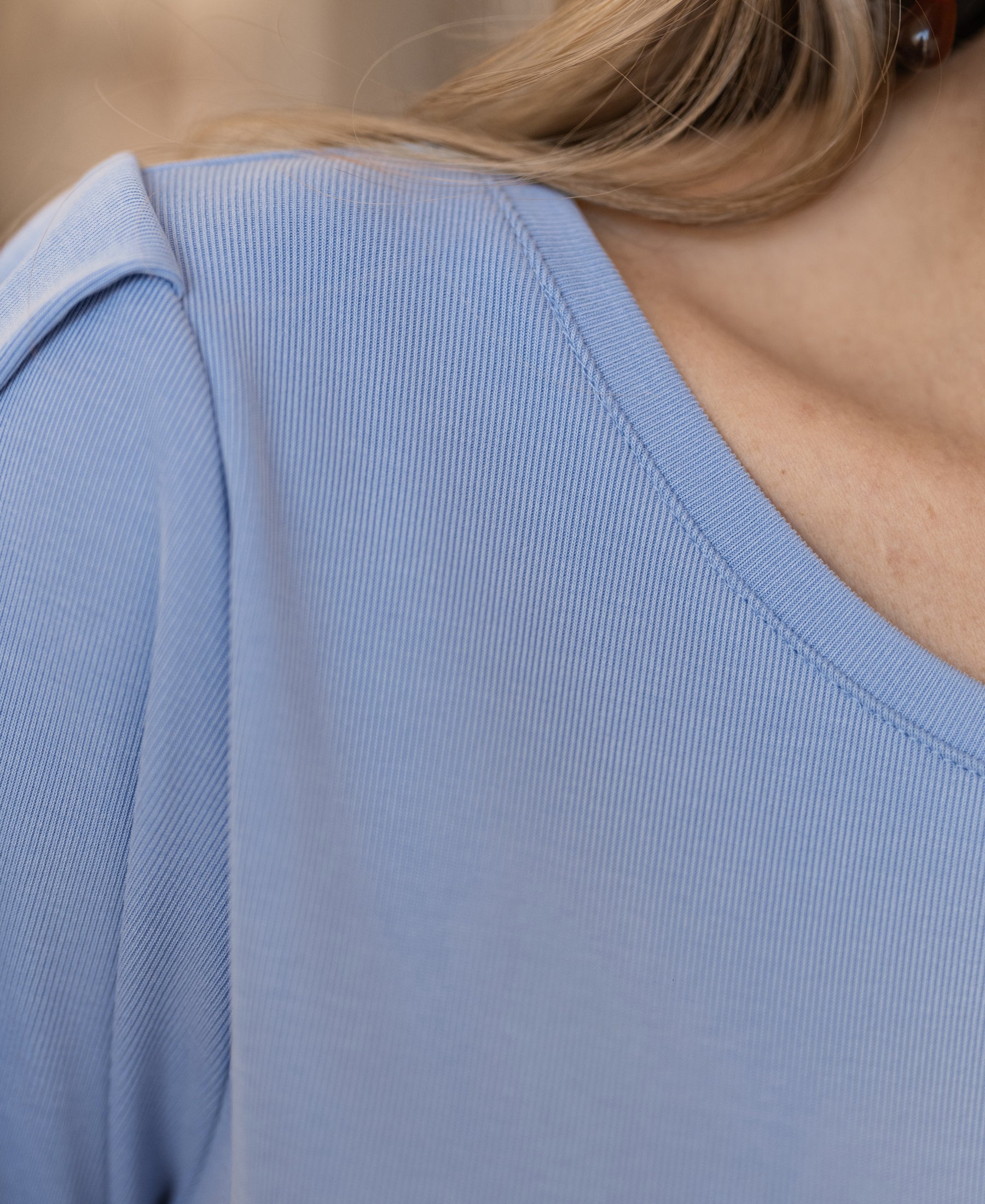 Close-up of the light blue PLEIN PUBLIQUE ribbed T-shirt, showing the neckline and shoulder.