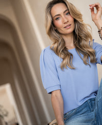 Light blue ribbed T-shirt in the LA PHILEINE style by PLEIN PUBLIQUE, shown on a woman with long blonde hair.