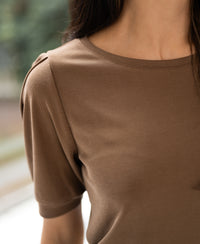 Ribbed tobacco-colored T-shirt in a shoulder-to-upper-torso view.