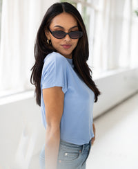 Light blue ribbed collared top by PLEIN PUBLIQUE, LA PIERRE style.