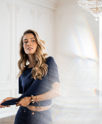 Navy stretch T-shirt with short sleeves by PLEIN PUBLIQUE displayed indoors with sunlight creating a rainbow effect.