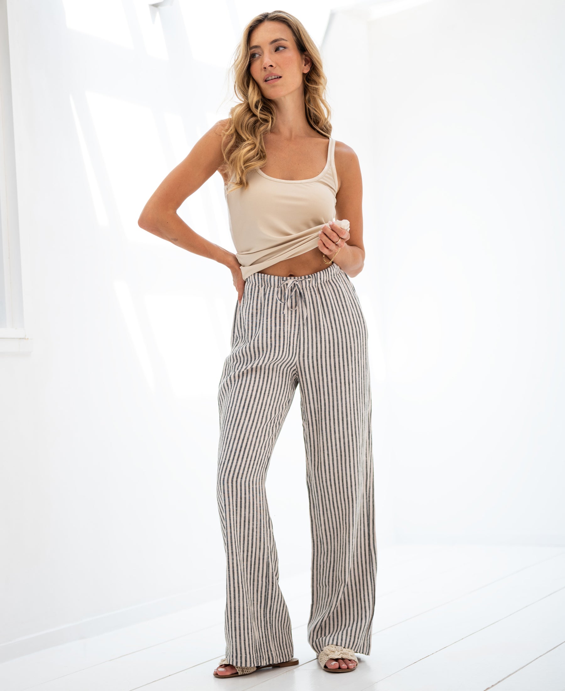 Striped linen-blend pants in anthracite by Plein Publique, shown in a bright room.