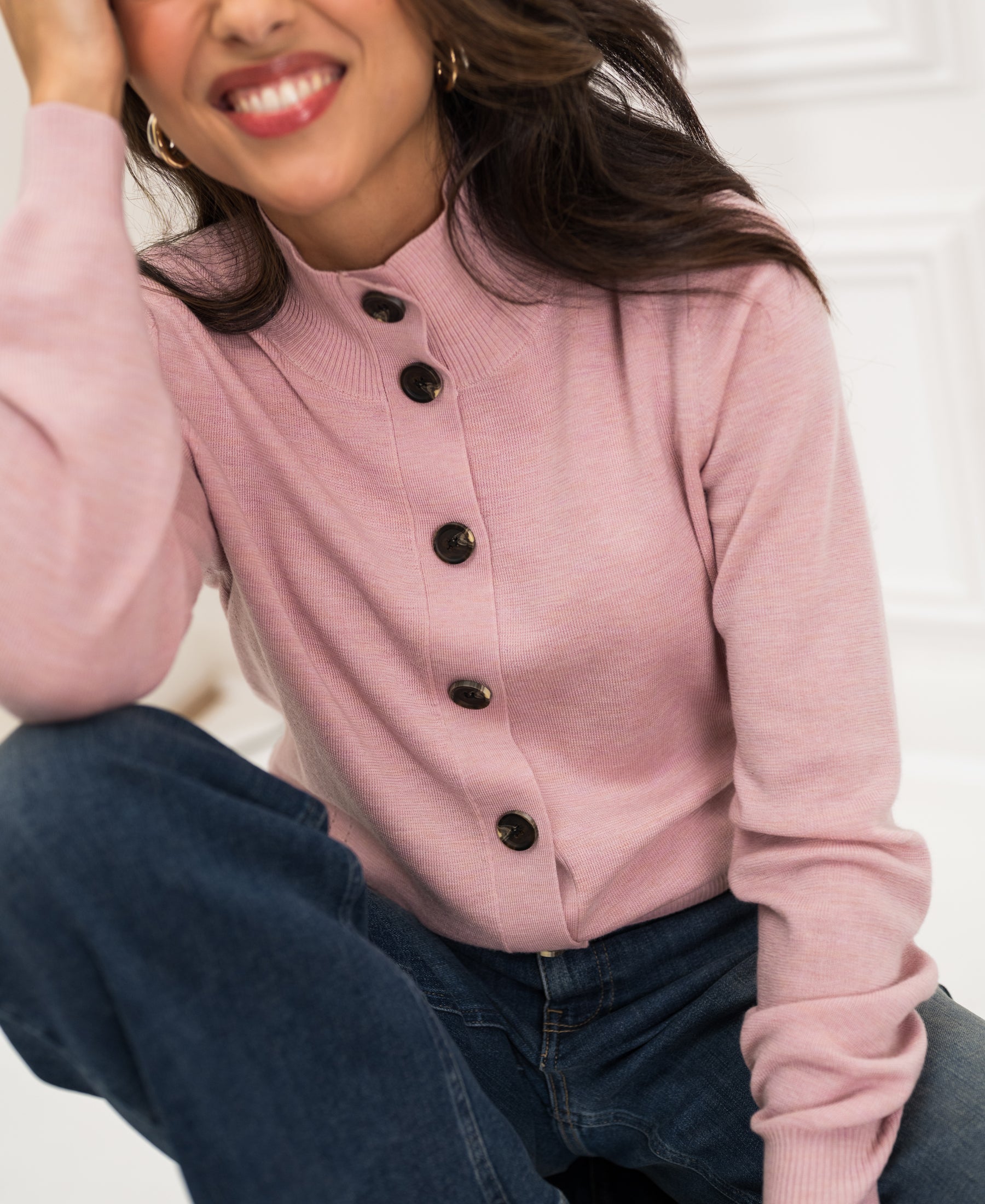 Rose merino vest in English by Plein Publique, shown against a white background.