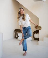 Cream bamboo turtleneck top by PLEIN PUBLIQUE LA SOMMET, shown indoors on a woman.