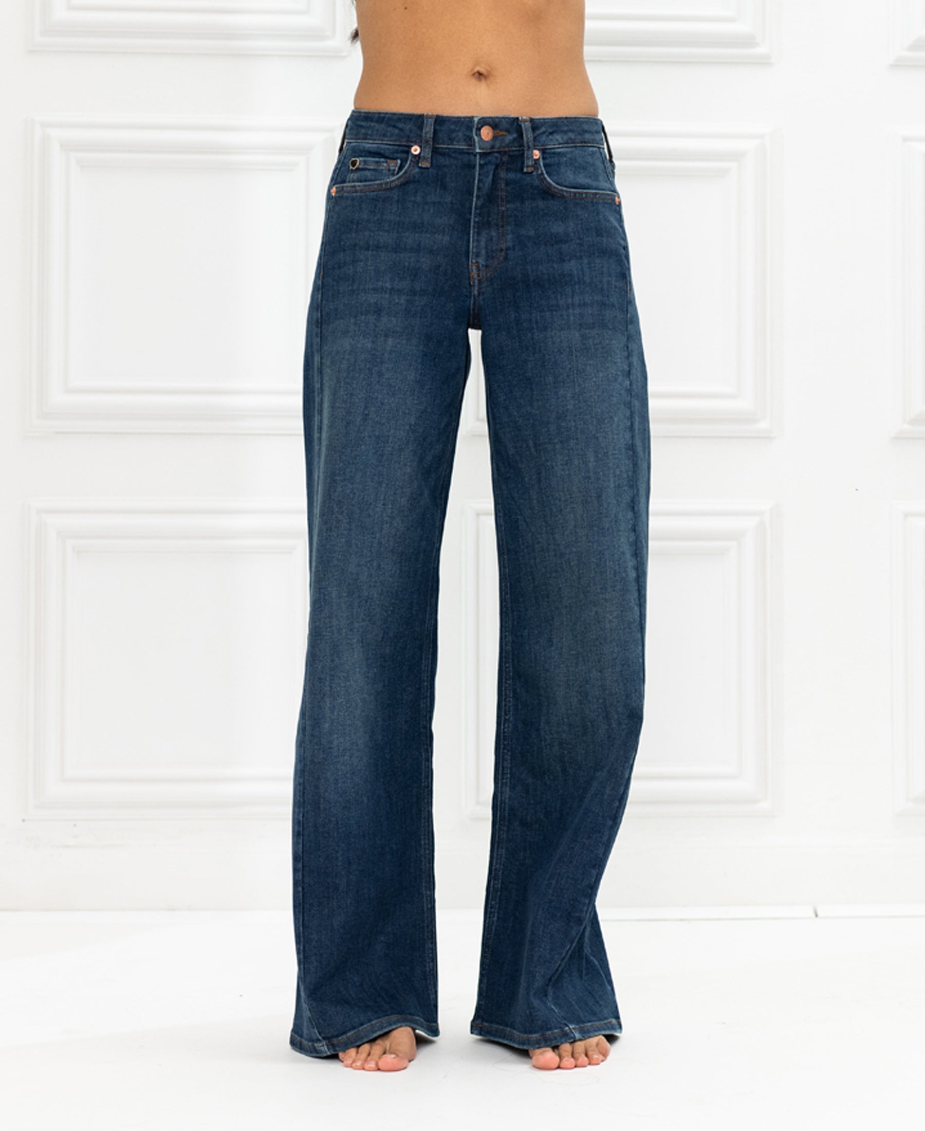 Wide leg jeans in Blue Heritage shown against a white paneled background.