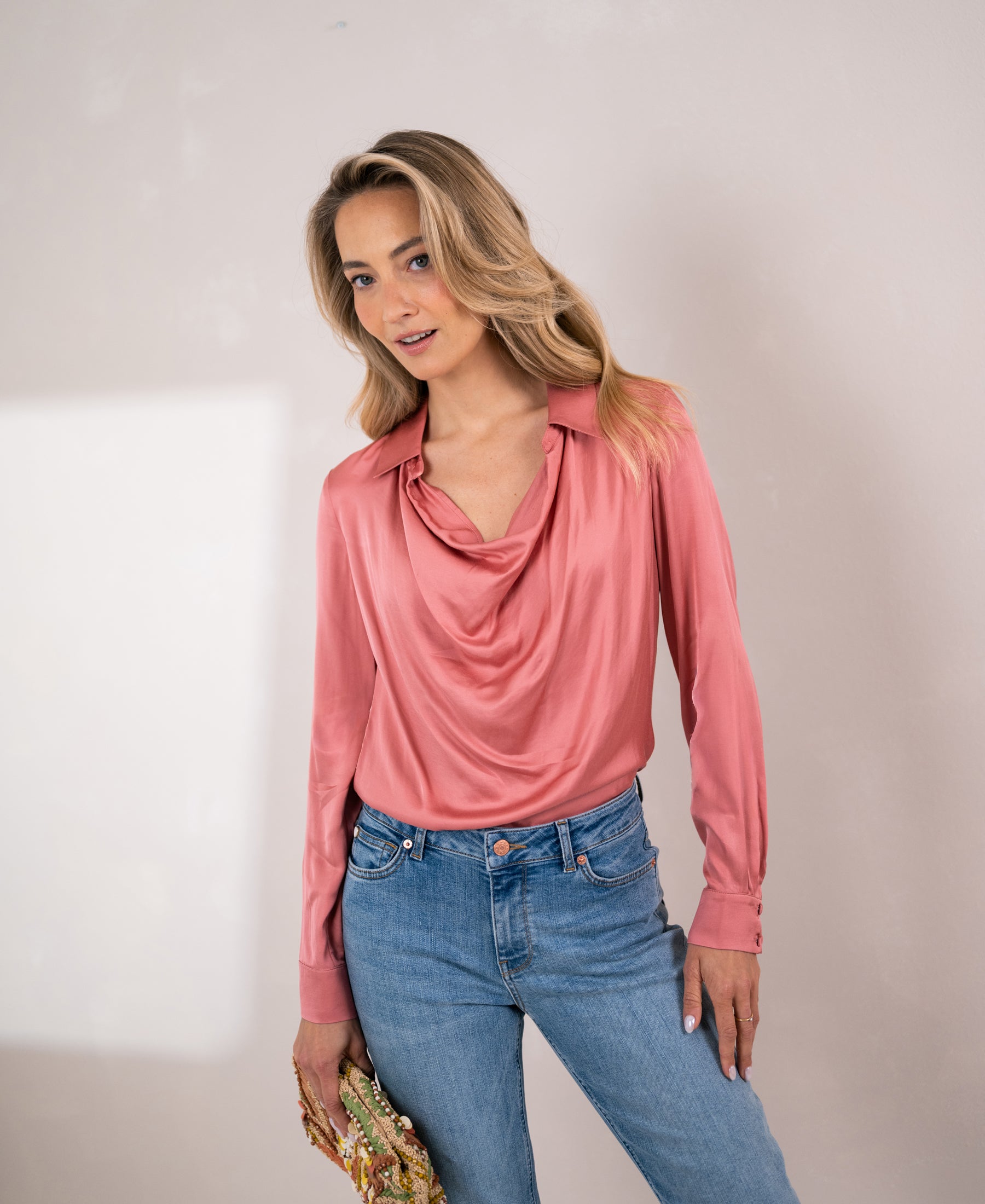 Dusty pink satin stretch blouse with long sleeves, shown from the front.