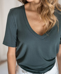 Ribbed, short-sleeved bamboo T-shirt shown from neck to waist.