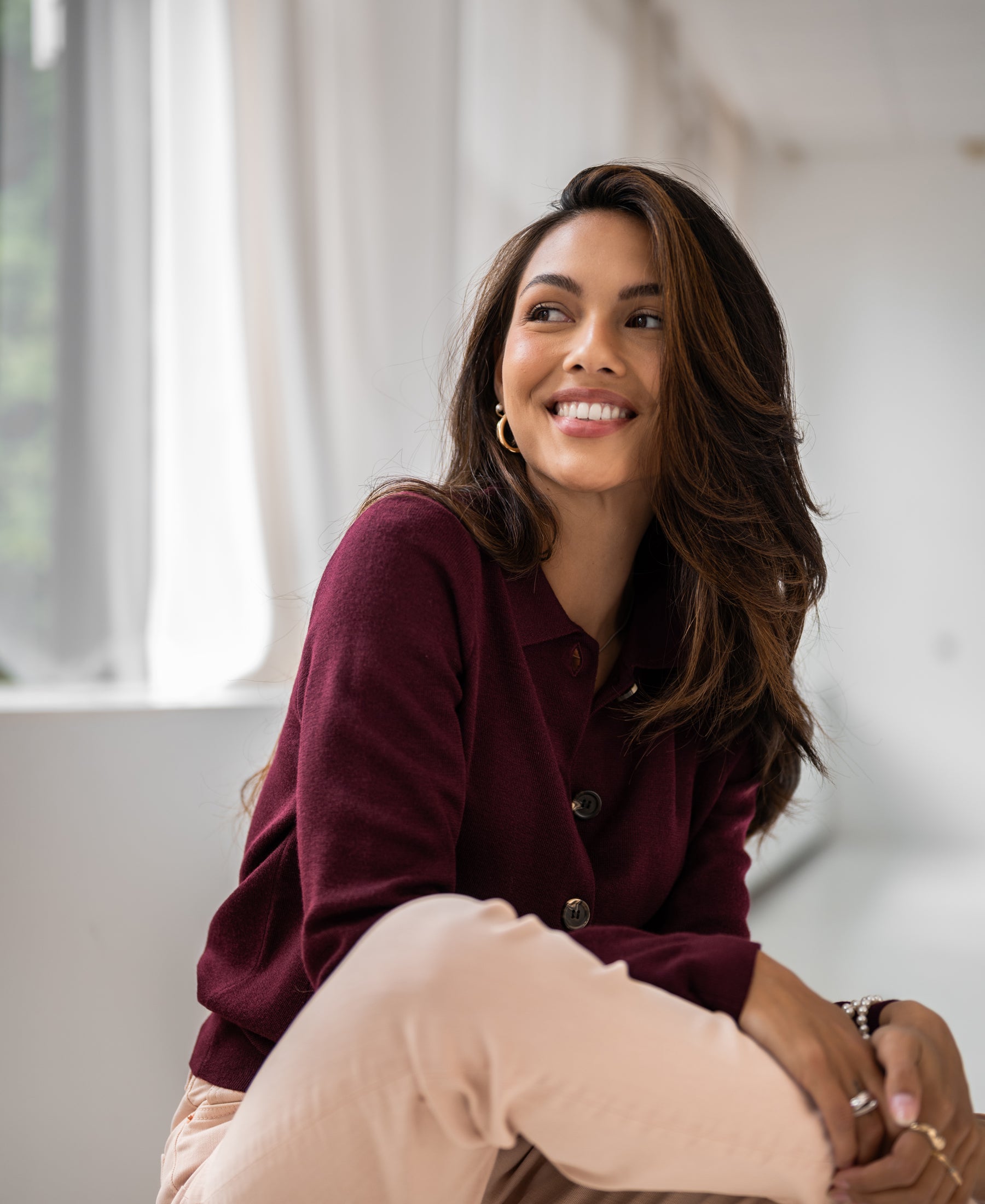 Bordeaux red polo-collar vest by PLEIN PUBLIQUE, shown on a woman indoors.