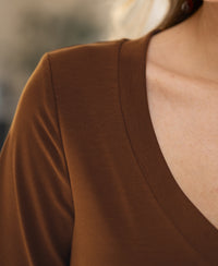 Close-up of a person wearing a PLEIN PUBLIQUE Havana stretch short-sleeve T-shirt, showing shoulder and collarbone.