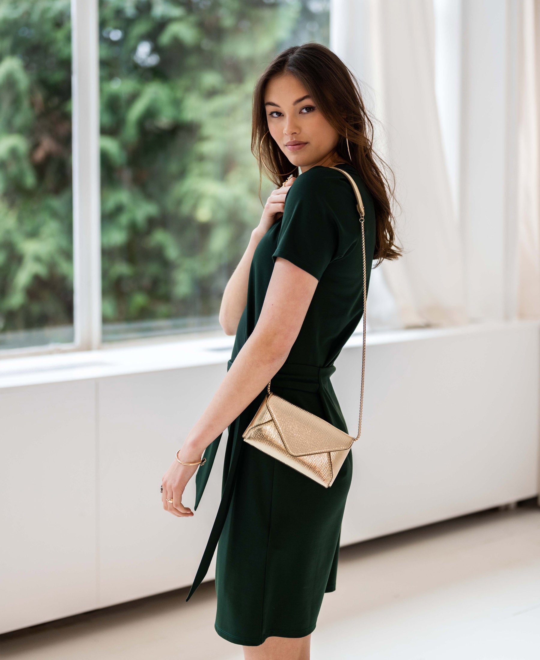 Dark green button dress by PLEIN PUBLIQUE shown indoors.