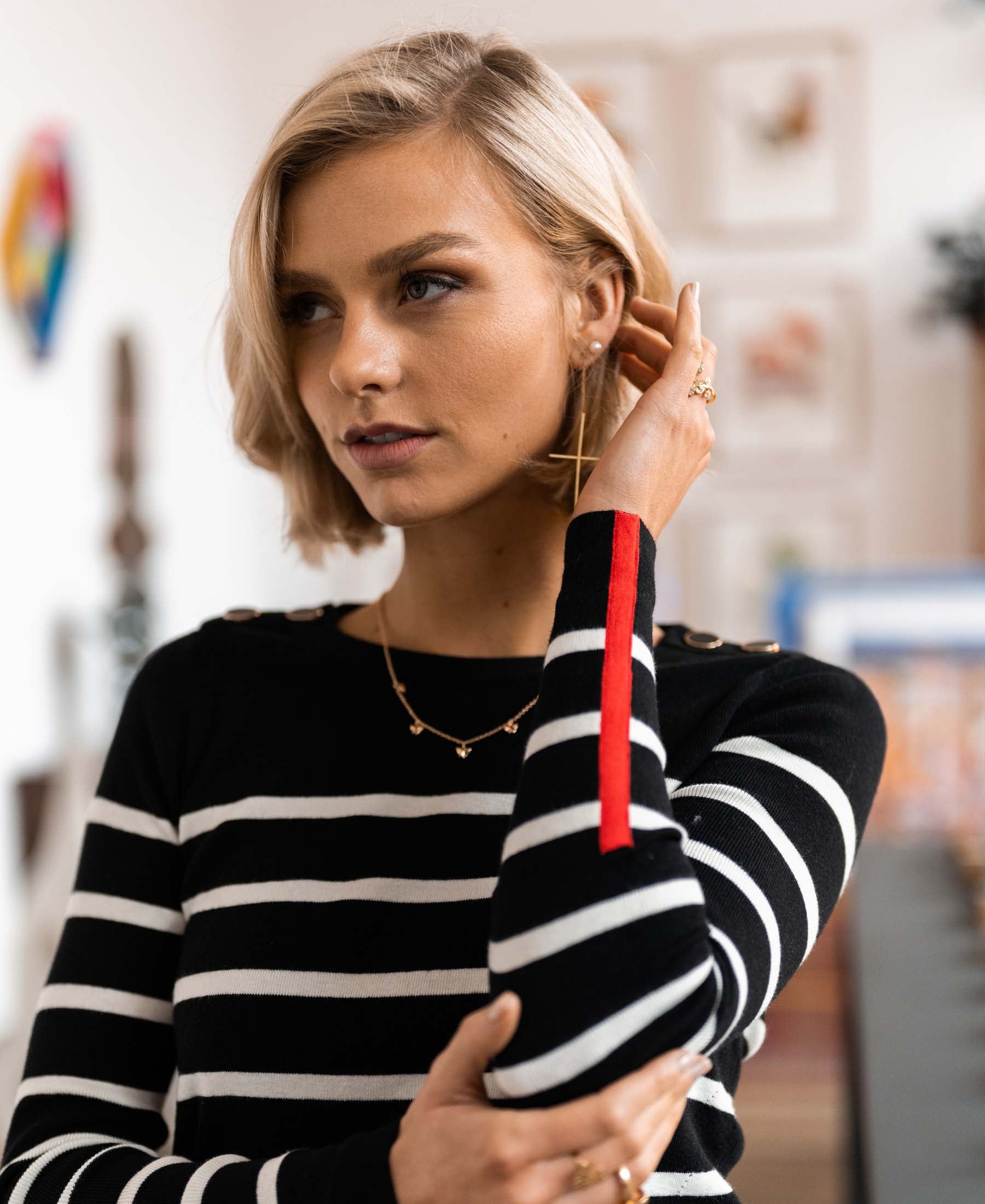 Woman wearing a Plein Publique L'Elisa black and ivory sweater.