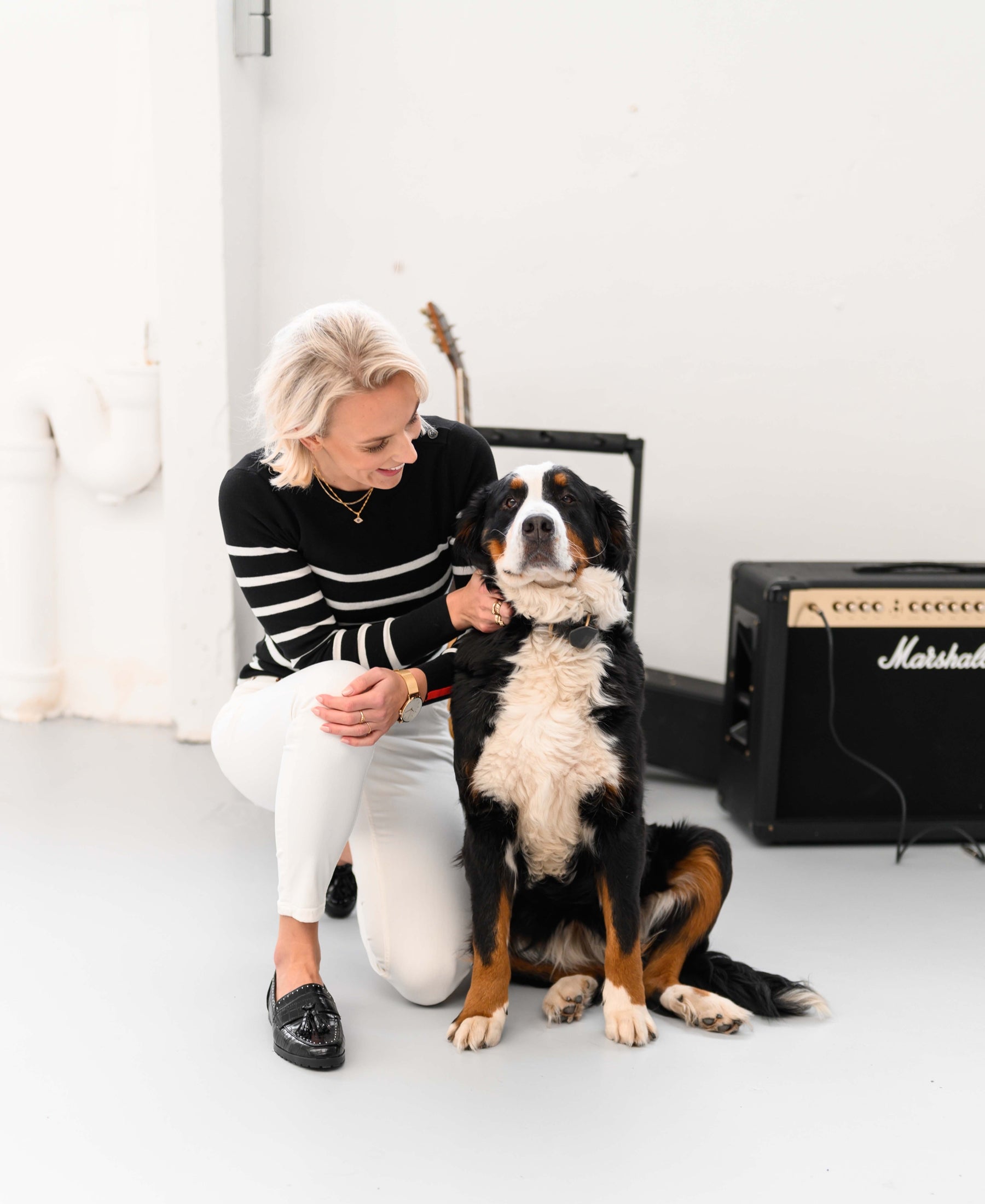 A black and ivory PLEIN PUBLIQUE L'ELISA sweater shown in a bright room.
